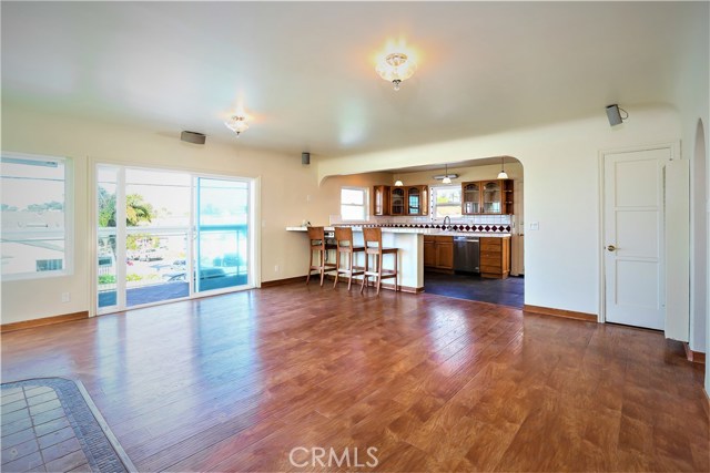 The open kitchen has a bar counter and the large sliders open out to the front deck.