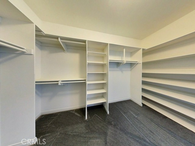 Wow! This is sure to please those that wish for a closet room which allows for additional dressers in the middle. Enjoy this extra wide and deep, organized walk-in closet in the Master Bedroom.