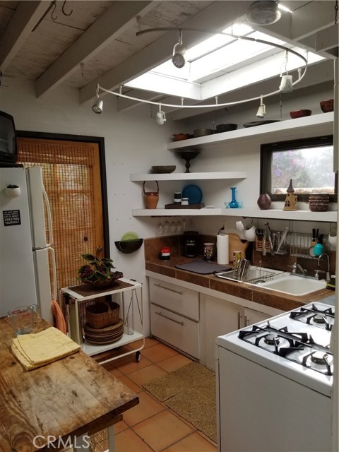 Outdoor kitchenette adjacent to guest quarters.