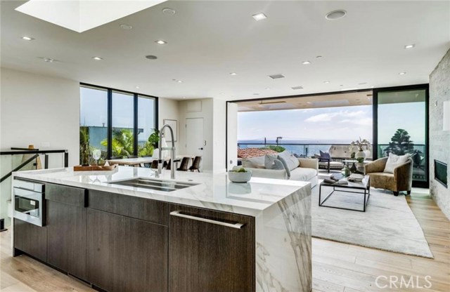 From the kitchen, enjoy the ocean breeze while you brew your morning coffee.