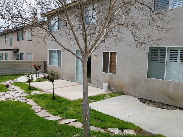 Large Backyard With Concrete Patio And Meandering Stone Walk That Leads To Your Garden.