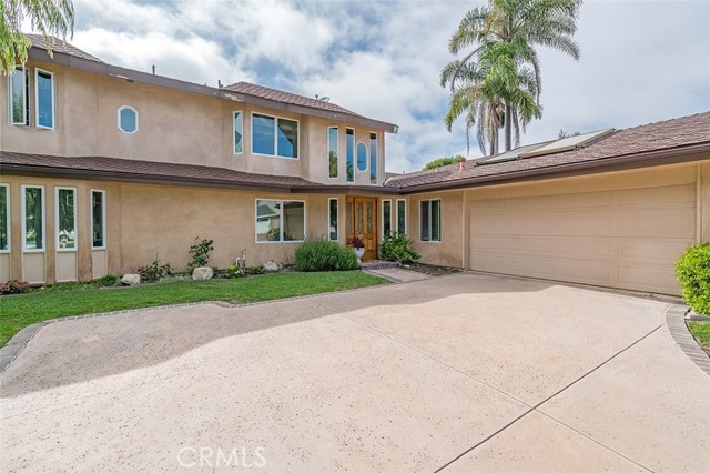 Stucco walls and two car garage