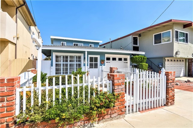 The brick and wood fencing encloses the nice front yard and entry walk.