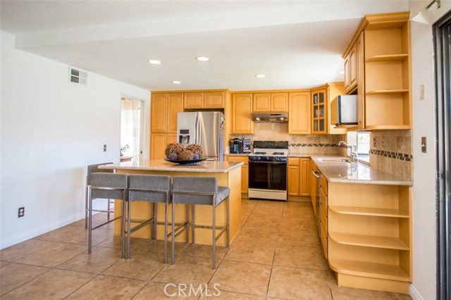 Large kitchen island for extra seating and prep space.