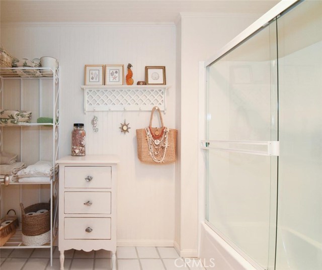 Full Bath Master Ensuite with bead board and glazed terracotta tile floors.