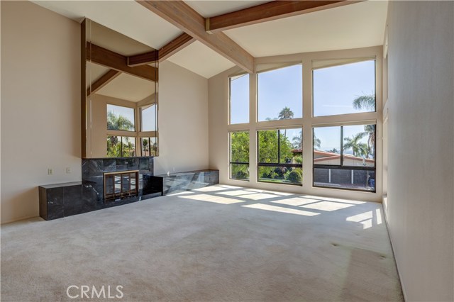 The right living room has a fireplace and view