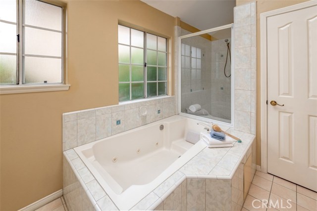 Jacuzzi tub and the door to the right leads to the shower and the toilet area