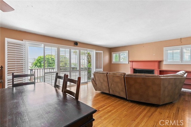 Upstairs unit dining area, living room, and balcony deck