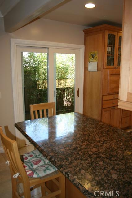 Sliding doors leading to side yard from kitchen.