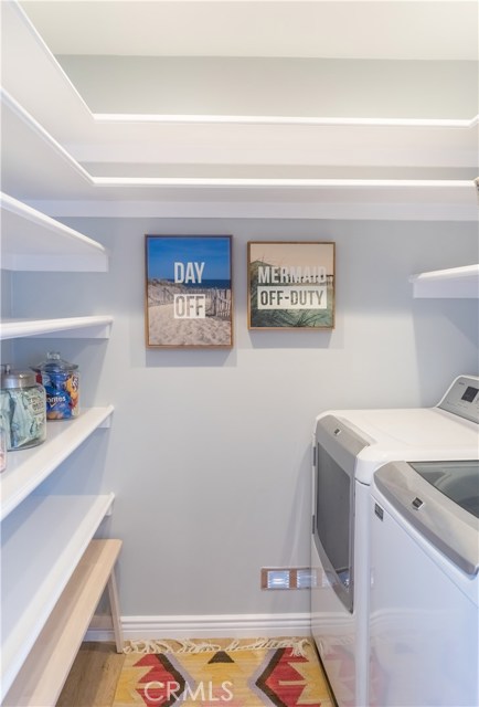 A walk-in pantry/laundry room is discretely located in the kitchen.