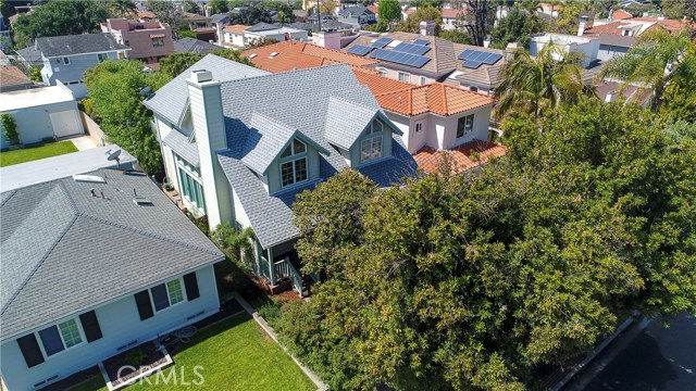 The best overall shot of the house is from the drone due to the mature Macadamia Nut and Camelia trees in front.