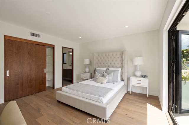 Spacious bedroom with private bath and generous closet space (shown here using reverse of 961 Unit A staging)