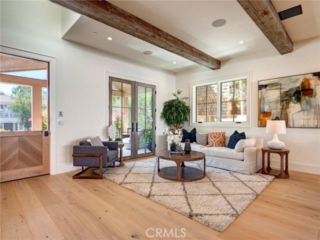 Dutch front door, Trestlewood solid reclaimed wood beams and ceiling accents, white oak flooring, huge open floor plan, LaCantina door systems for indoor/outdoor feel, surround sound throughout home.  Crestron whole home automation.
