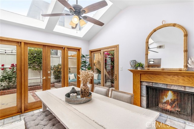 Dining Room has fireplace, skylights and open concept to private patio and deck