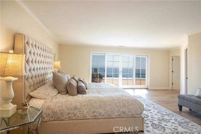 Owners bedroom with a view and doors to the outside deck