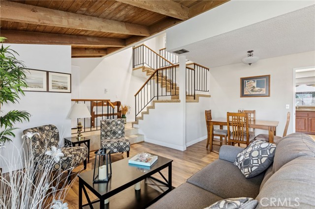 Dining area leads into kitchen. Stairs lead up to 3 or 4 bedrooms.