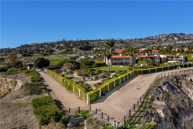 Aerial view of home, yard, and walking path