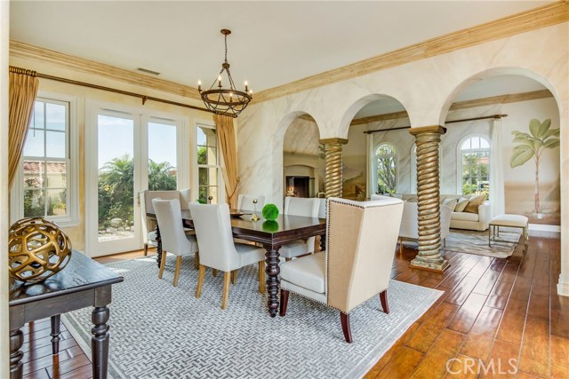 Beautiful distressed hardwood flooring circle the entire property - here we are in the dining room.