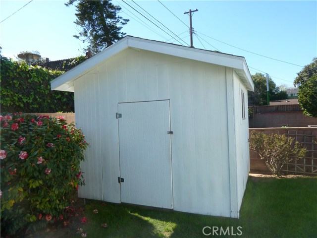 Insulated storage shed in rear yard Insulated storage shed in rear yard