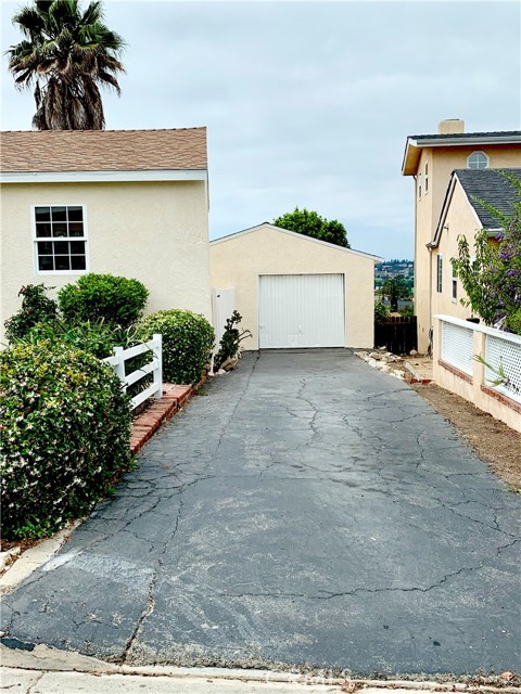 Long driveway for multi-car or RV parking. Large, single door garage.