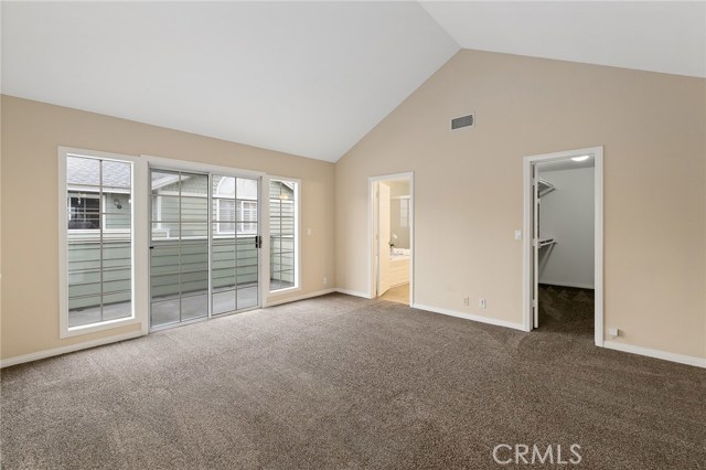 Master bedroom facing patio and Master Bath entrance and walk in closet