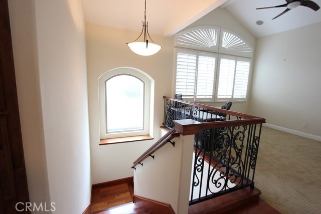 Stairwell, natural lighting from windows in the transom.