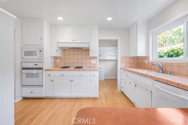 Kitchen with door to laundry room and new flooring