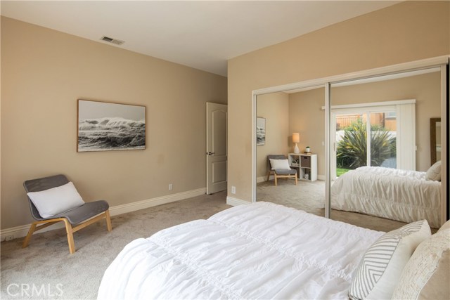 Bedroom #3 - A bright and spacious retreat with large closets and direct access to the private backyard.