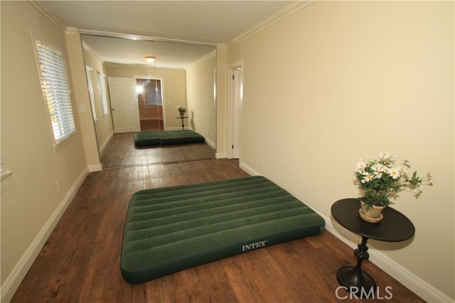 Bedroom #1 with large mirrored closet and direct access to the bathroom.