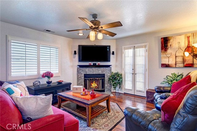 Upstairs family room area complete with fireplace and ceiling fan.  Can be walled off to be made into 4th bedroom as builder's plans originally called for.