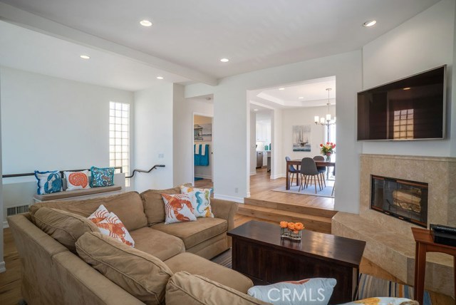 Top of the world third level includes the Living Room, Dining Room, updated Powder Bath, completely remodeled Kitchen, and enormous and functional deck space.