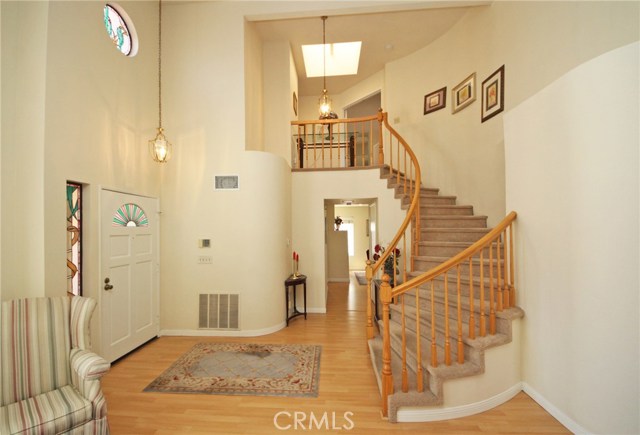 Foyer under a vaulted 2-story ceiling