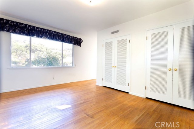 Master BR with double closets looks out at garden with pool view beyond.  Ocean peek out other side.