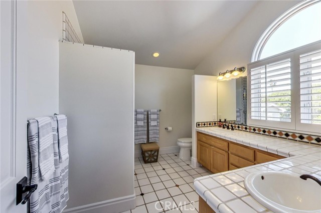 Full bathroom servicing bedrooms 3 and 4. Twin vanities and lots of counter space.