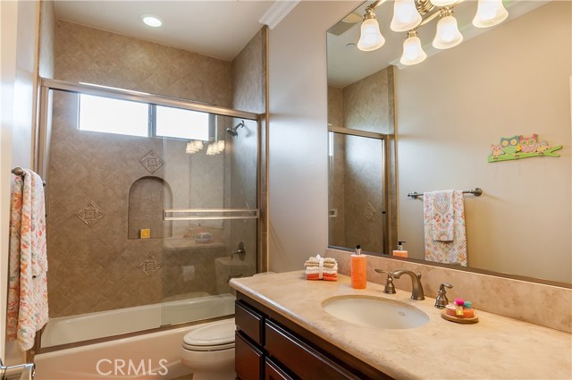 The fourth bath includes tile flooring and shower / tub combo.
