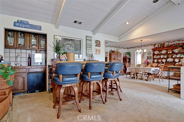 wet bar with sink and fridge