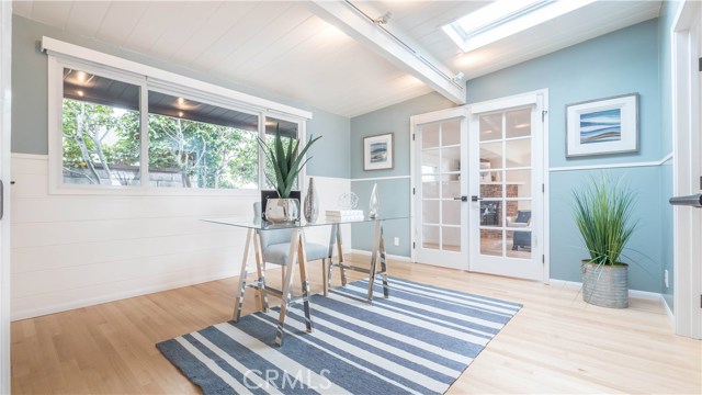 Bedroom office with french doors and skylight