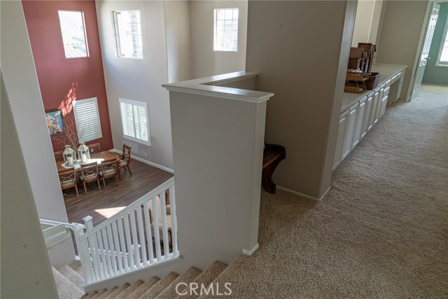 View from upstairs hallway to dining room