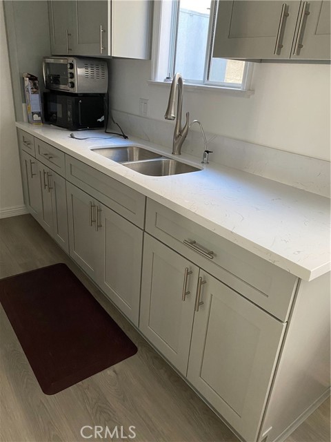 Kitchen sink with microwave and toaster oven