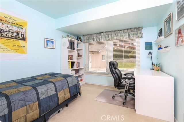 Second bedroom, large windows overlooking back yard.