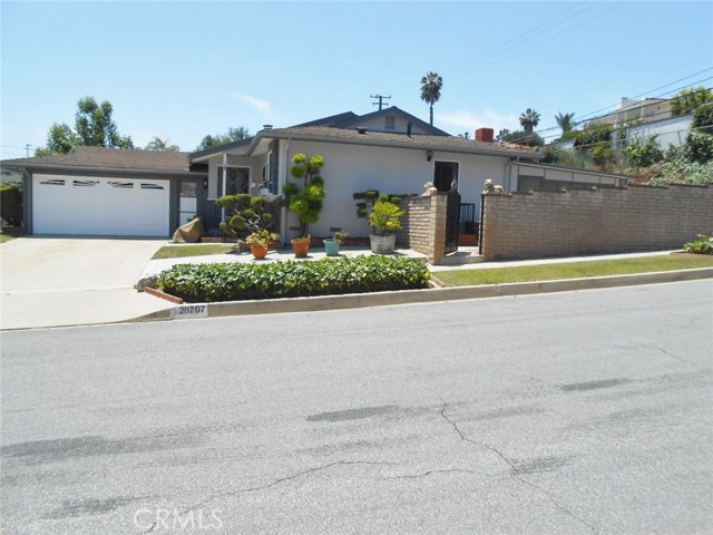 Over 6500+ Square Foot Lot with: Extra Cemented Parking Area at side of Home, Side Gate to Backyard and Utility Room; you can choose your entrance (s).