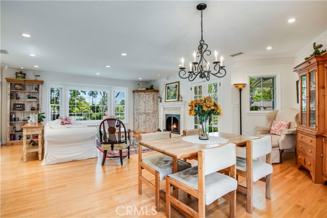 LARGE OPEN LIVING AND DINING ROOM WITH FRENCH DOOR LEADING TO DRIVEWAY