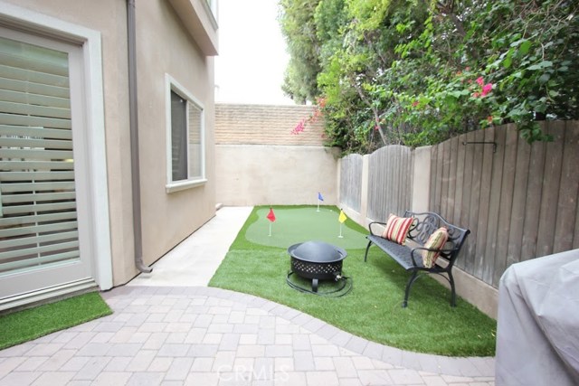 A proper backyard patio area for leisure and enjoyment rather than maintenance and toil. Natural gas line, Barbecue/fire pit ready, and putting green make for a quiet outdoor retreat.