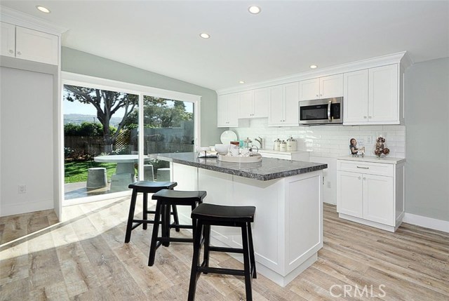 Kitchen in the guest house with center island for eating area