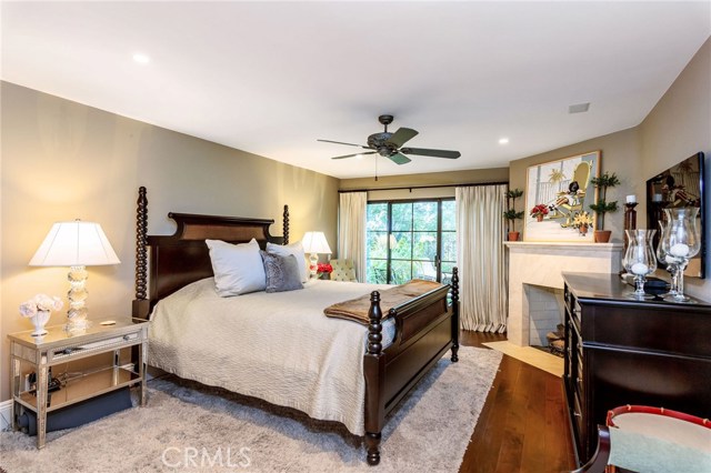 From the first floor hallway you enter the Master Bedroom suite with fireplace and sliding glass doors which lead to a private patio and grassy area.