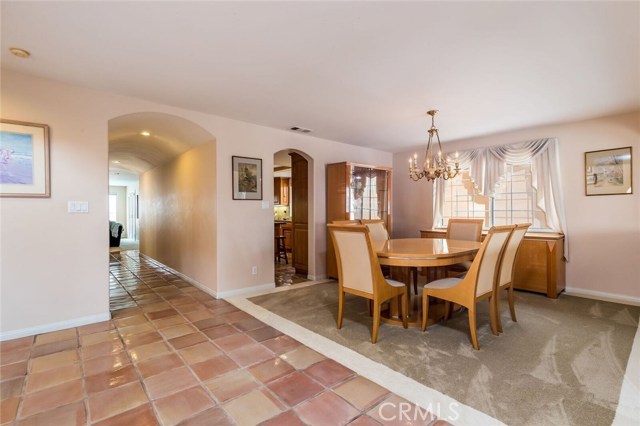 Dining room from the entry looking to hallway and entrance to the kitchen.