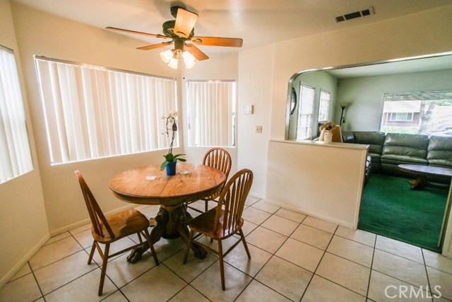 ROOMY EATING AREA IS OPEN TO THE KITCHEN.