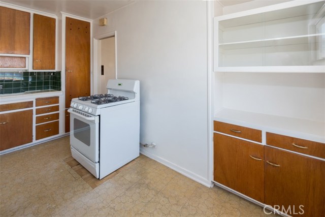 Kitchen view with stove and built ins