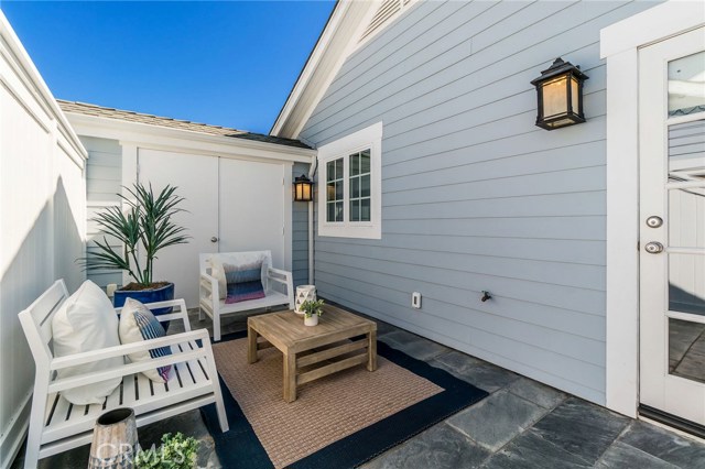 The home is attached by only the garages and upstairs balconies, for total privacy inside.  There is a huge storage closet behind those doors - possibly a place for a built-in bar with fridge and TV?