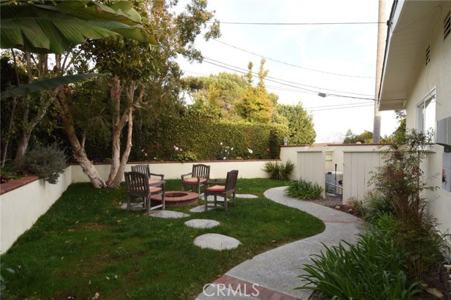 Super private grassy yard area with built-in firepit...you'll want to hang out here!